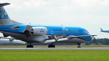 AMSTERDAM, THE NETHERLANDS JULY 26, 2017 - KLM Cityhopper Fokker 70 PH KZB braking after landing at runway 36L Polderbaan. Shiphol Airport, Amsterdam, Holland video