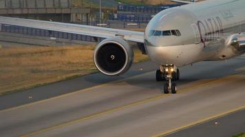 FRANKFURT AM MAIN, GERMANY JULY 17, 2017 - Qatar Airways Boeing 777 taxiing after landing at 07L runway. Fraport, Frankfurt, Germany video