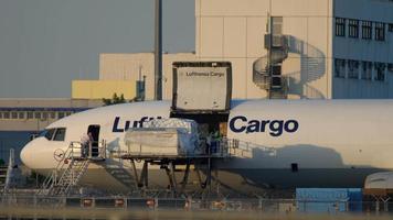 FRANKFURT AM MAIN, GERMANY JULY 18, 2017 - Cargo loading to Lufthansa Cargo McDonnell Douglas MD 11 airfreighter video