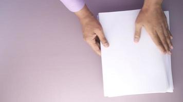 Top View Of Mens Hand On Blank Paper On Table video