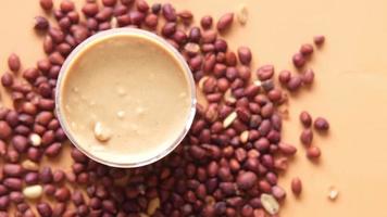 Slow Motion Of Pouring Processed Pea Nuts In A Bowl On Table Top Down video