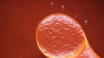 Pouring Tomato Sauce From A Spoon Top View video