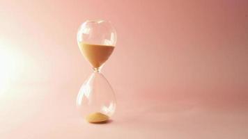 Hourglass On Table, Sand Flowing Through The Bulb Of Sandglass video