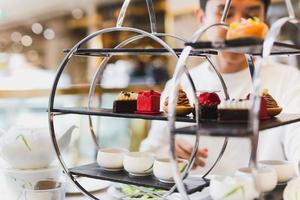 Afternoon tea time and dessert on table. photo