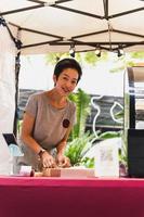 Woman small business owner  packing box on table delivery to customer. photo