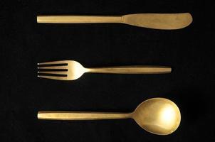 Metal cutlery set on black background photo