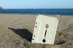 Cassette tape on the sand photo