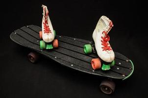 Roller skates on skateboard photo