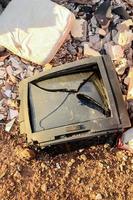 Broken TV on the ground photo