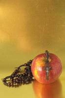 Apple with crucifix photo