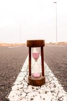 Hourglass on the road photo