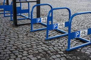 Blue bike parking sign with a bicycle background. photo