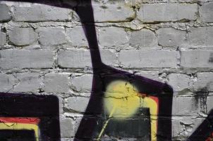 Background image of the wall decorated with colorful abstract graffiti. Street art concept photo