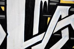 Background image of the wall decorated with colorful abstract graffiti. Street art concept photo