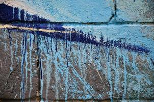 Background image of the wall decorated with colorful abstract graffiti. Street art concept photo