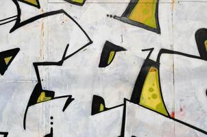 Art under ground. Beautiful street art graffiti style. The wall is decorated with abstract drawings house paint. Modern iconic urban culture of street youth. Abstract stylish picture on wall photo