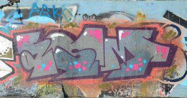 The old wall, painted in color graffiti drawing red aerosol pain photo
