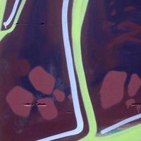 Fragment of graffiti drawings. The old wall decorated with paint stains in the style of street art culture. Colored background texture photo