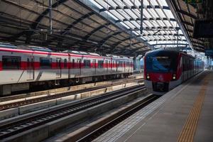 Bangkok, Thailand, December 29, 2022, Two commuter trains of the State Railway of Thailand or Red Line service at Laksi station. photo