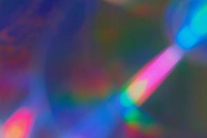 Blurred rainbow colored light flare background. photo