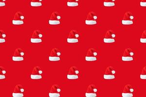 Santa Claus hat seamless pattern on red background photo