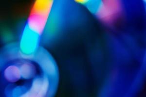 Blurred rainbow colored light flare background. photo
