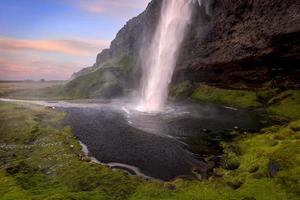 Scenic Seljalandsfoss water falls in southern Iceland, long exposure shot. photo