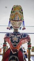 Indonesian authentic wayang golek, wooden carved rod puppet. photo