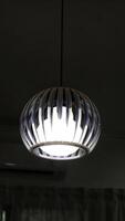 Indoor minimalist beautiful modern circle glass hanging lamp at the ceiling. photo