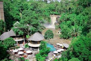 Gianyar, Indonesia - January 06 2023 Photo of a view of a restaurant adjacent to the Tegenungan waterfall, taken from above.