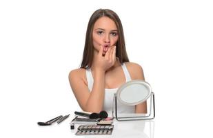 Female model checking irritated face skin photo
