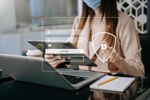 Cyber security concept, Login, User, identification information security and encryption, secure access to user's personal information woman using smart phone and tablet photo
