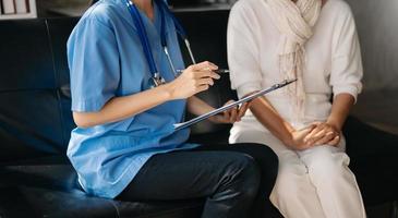 Kind nurse together with elderly woman in the hospital's photo