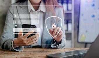 Cyber security concept, Login, User, identification information security and encryption, secure access to user's personal information woman using smart phone and tablet photo