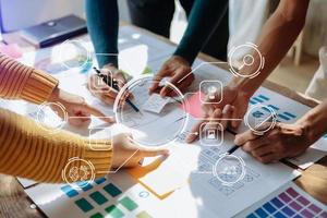 UX developer and ui designer brainstorming about mobile app interface wireframe design with customer breif and color code at office. with VR icon photo