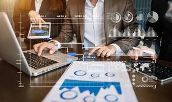 Businessman hand Project manager working and update tasks and Gantt chart scheduling virtual diagram.with smart phone, tablet and laptop photo