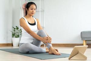 woman practicing meditate on the park. Asian woman doing exercises in morning. balance, recreation, relaxation, calm, good health, happy, relax, healthy lifestyle, reduce stress, peaceful, Attitude photo