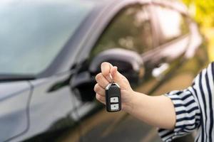 lease, rental car, sell, buy. Dealership manager send car keys to the new owner.  Sales, loan credit financial, rent vehicle, insurance,  renting, Seller, dealer, installment, car care business photo