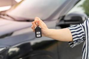 lease, rental car, sell, buy. Dealership manager send car keys to the new owner.  Sales, loan credit financial, rent vehicle, insurance,  renting, Seller, dealer, installment, car care business photo