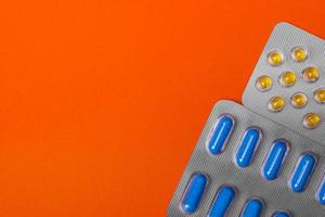 Packs of pills - abstract medical background. Colored Pills. photo