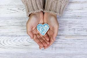 Woman's hands holding a cookies. holiday cookies photo