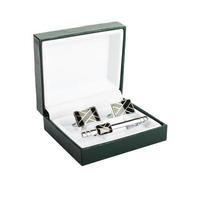 Cuff links in a box on white background photo