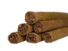 Cuban cigar closeup isolated over white background photo