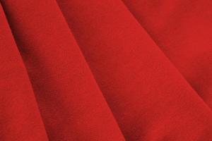 Soviet Union flag with big folds waving close up under the studio light indoors. The official symbols and colors in banner photo
