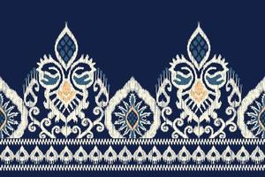 Ikat floral paisley embroidery on navy blue background.geometric ethnic oriental pattern traditional.Aztec style abstract vector illustration.design for texture,fabric,clothing,wrapping,scarf,sarong.