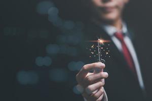 solution concept and demonstrating leadership strategies,that lead the business in a successful direction,with innovation and brain power from brainstorming,businessman holding a key photo