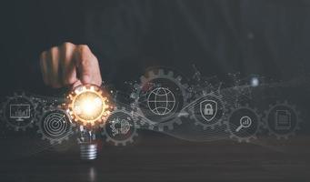 for Concept new idea, concept with innovation and inspiration, innovative technology in science concept and modern business development,creative idea,man pointing light bulb on table photo