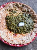 Famous Indian food specially prepared in winters, makki ki roti - sarson ka saag photo