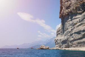 Landscape of Turkey natural rock mountains over blue sea water photo