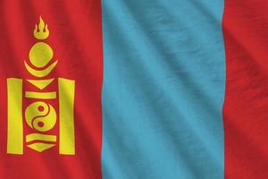 Mongolia flag with big folds waving close up under the studio light indoors. The official symbols and colors in banner photo